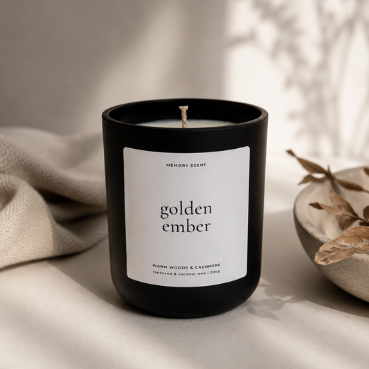 Candle labeled 'golden ember' on a neutral background