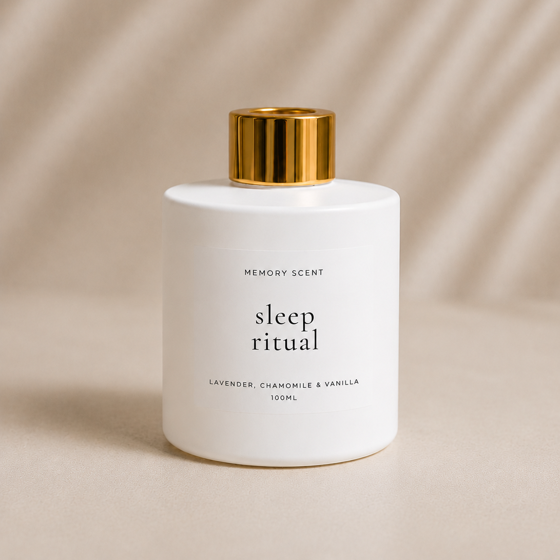 White Jar Diffuser with gold lid labeled 'sleep ritual' on a beige background.