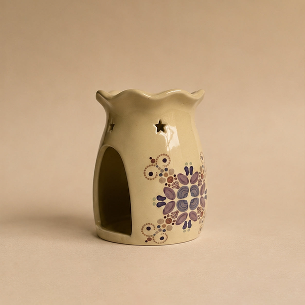Ceramic wax burner oil burner with sea themed coastal design on a beige background