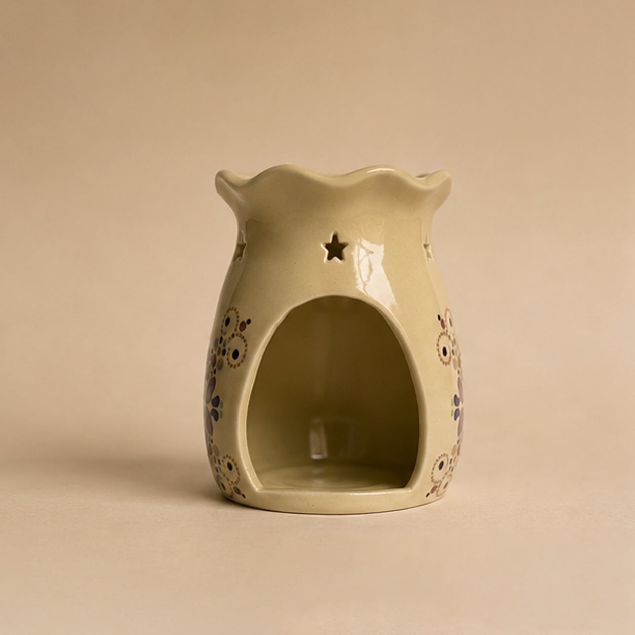 Ceramic wax burner decorative patterns on a beige background
