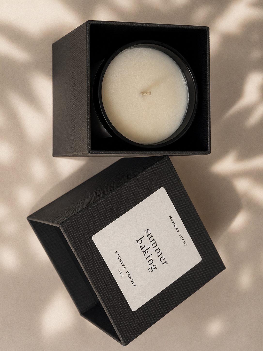 Candle in a black box with 'Summer Baking' label on a beige background