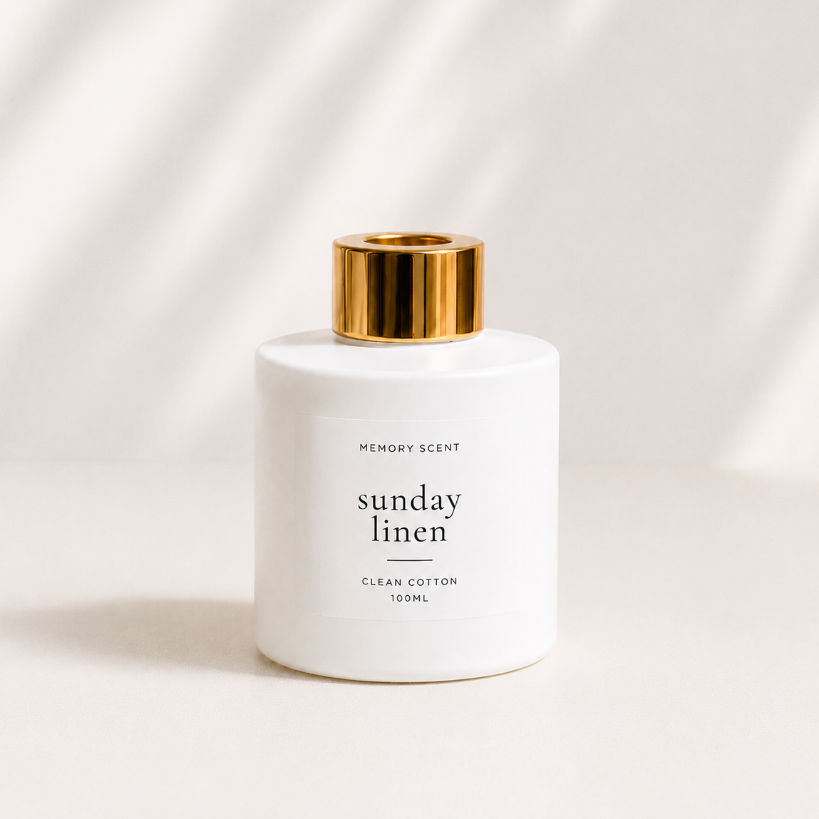 White diffuser bottle with gold cap labeled  on a white background