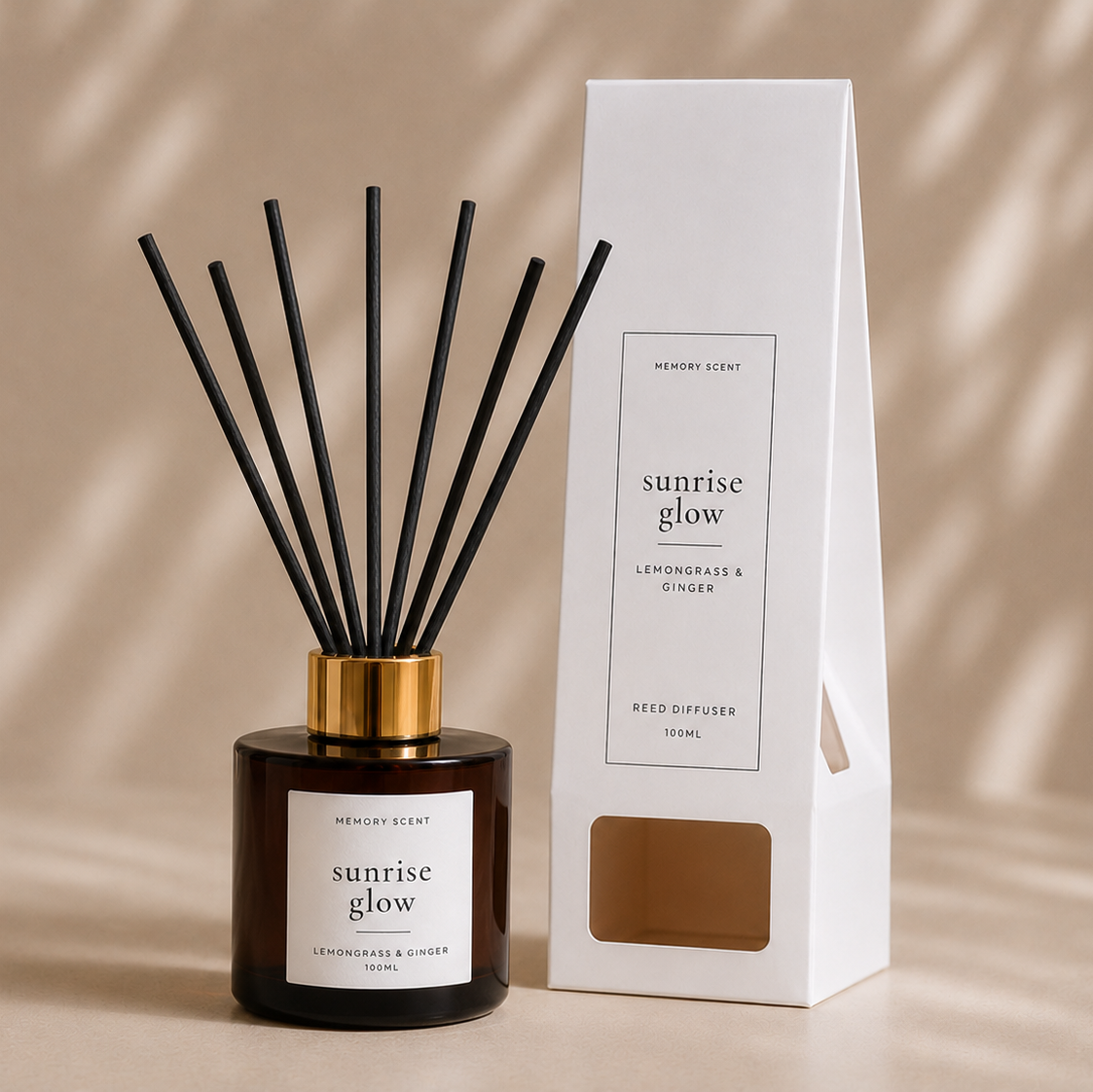 Reed diffuser with reed diffuser packaging labelled 'Sunrise Glow' on a beige background