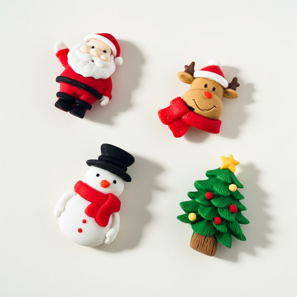 Four Christmas-themed figurines on a white background
