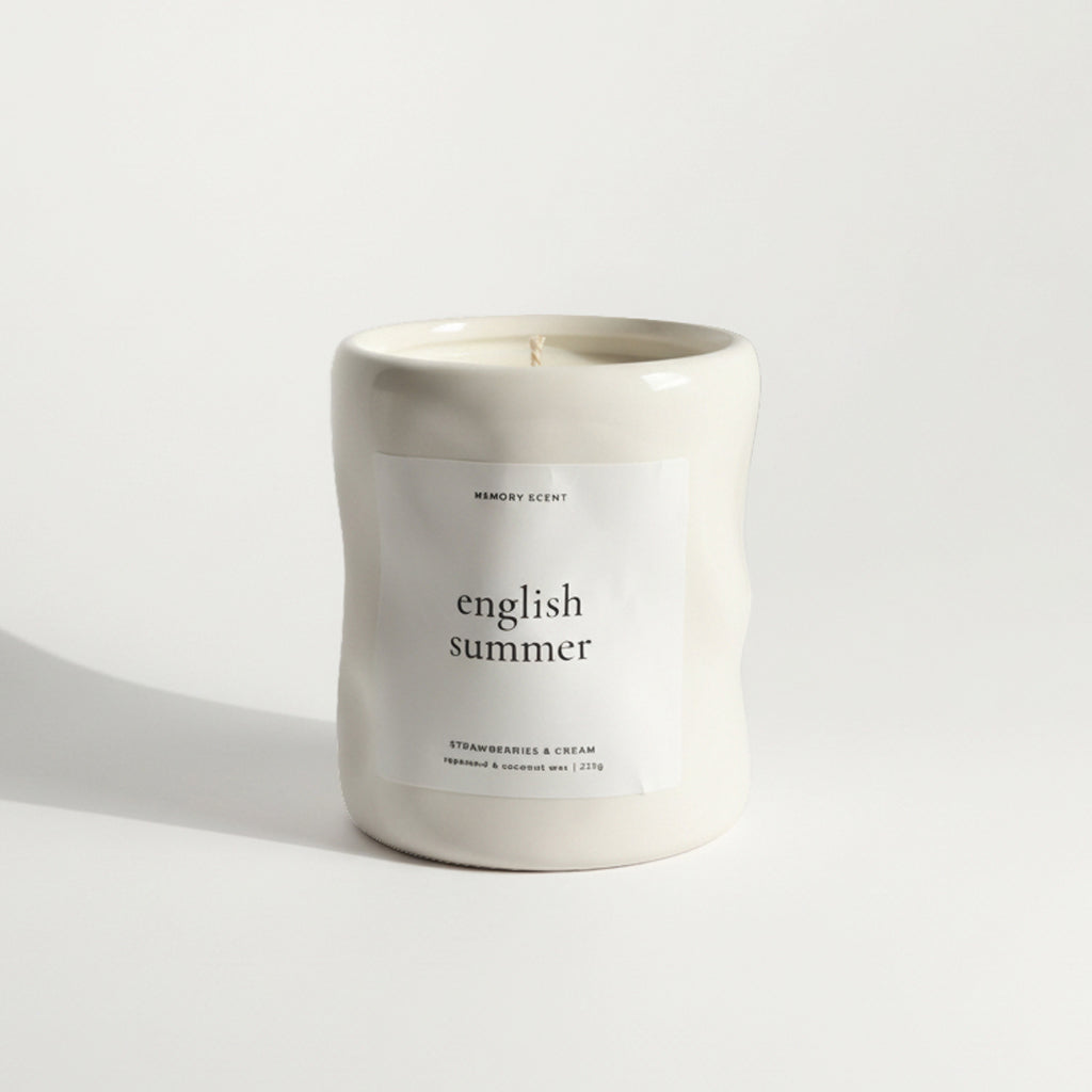 Candle labeled 'english summer' on a light background